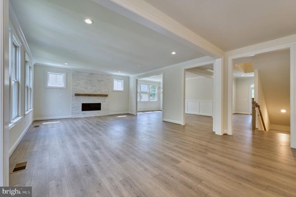 Empty room, Fireplace, Interior, Recessed Lighting, Stone Walls, Wood Texture Flooring