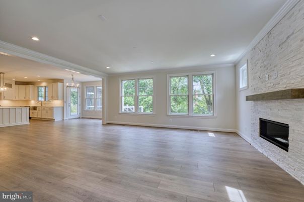Chandelier, Empty room, Fireplace, Interior, Kitchen, Pendant Lights, Recessed Lighting, Stone Walls, Wood Texture Flooring