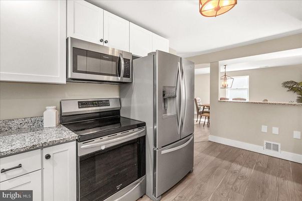 Dining room, Interior, Kitchen, Pendant Lights, Stainless Steel Appliances, Wood Texture Flooring