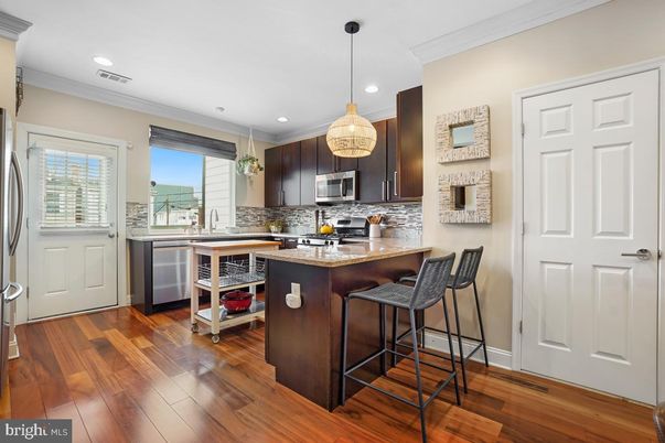 Interior, Kitchen, Pendant Lights, Recessed Lighting, Stainless Steel Appliances, Wood Texture Flooring