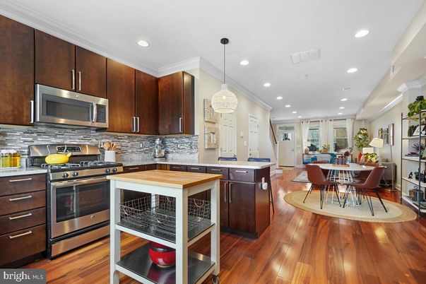 Dining room, Interior, Kitchen, Pendant Lights, Recessed Lighting, Stainless Steel Appliances, Wood Texture Flooring