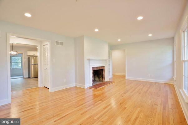Empty room, Fireplace, Interior, Kitchen, Pendant Lights, Recessed Lighting, Wood Texture Flooring