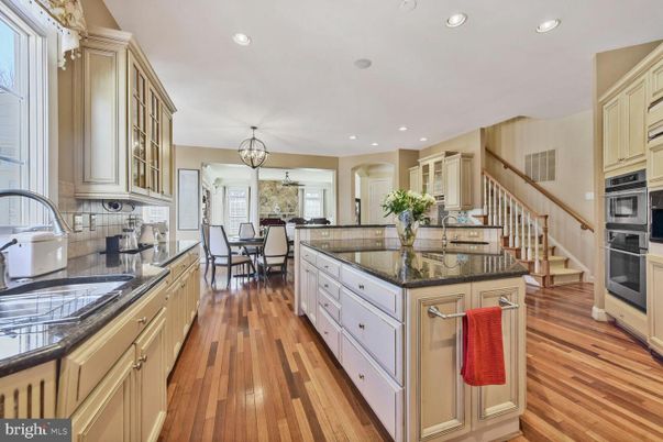 Chandelier, Dining room, Interior, Kitchen, Recessed Lighting, Stainless Steel Appliances, Wood Texture Flooring
