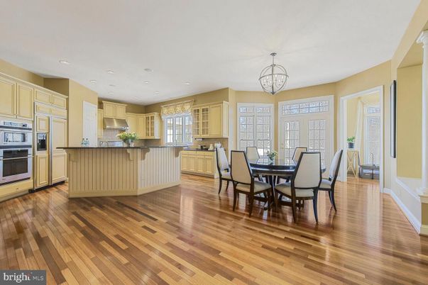 Chandelier, Dining room, Interior, Kitchen, Recessed Lighting, Stainless Steel Appliances, Wood Texture Flooring