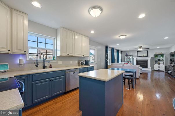 Dining room, Fireplace, Interior, Kitchen, Recessed Lighting, Wood Texture Flooring