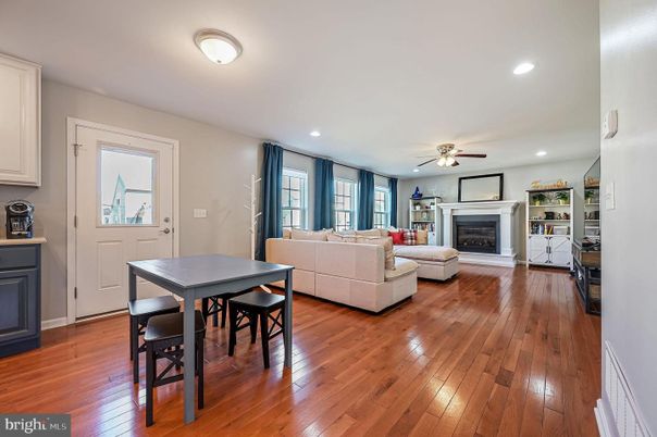 Dining room, Fireplace, Interior, Living room, Recessed Lighting, Wood Texture Flooring