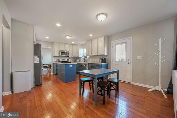 Dining room, Interior, Kitchen, Recessed Lighting, Stainless Steel Appliances, Wood Texture Flooring