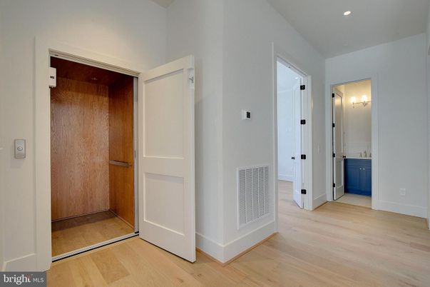 Elevator, Interior, Recessed Lighting, Wood Texture Flooring