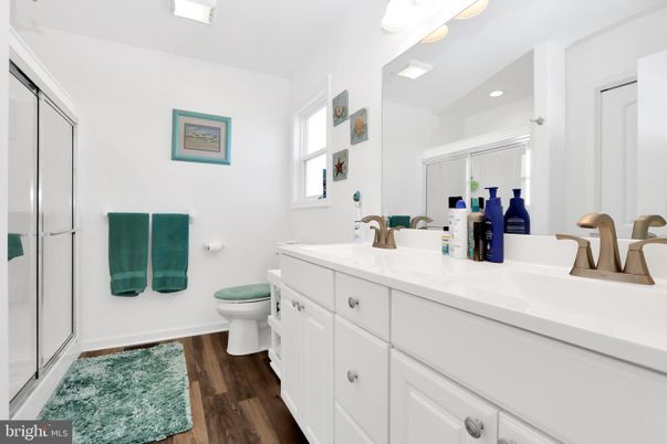 Bathroom, Dual Sink Vanities, Glass Shower, Interior, Recessed Lighting, Wood Texture Flooring