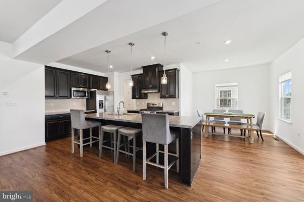 Dining room, Interior, Kitchen, Pendant Lights, Recessed Lighting, Stainless Steel Appliances, Wood Texture Flooring