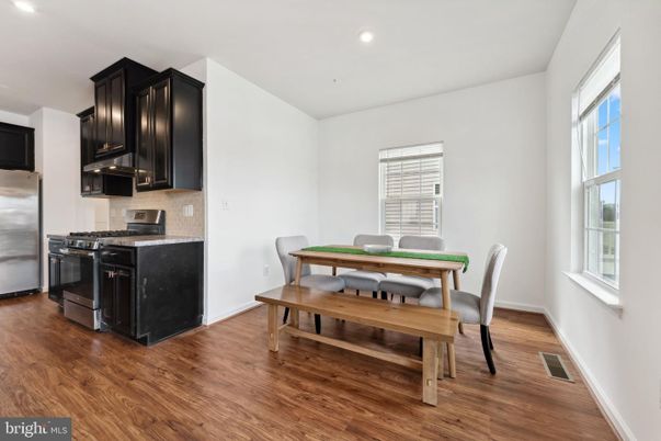 Dining room, Interior, Kitchen, Recessed Lighting, Stainless Steel Appliances, Wood Texture Flooring