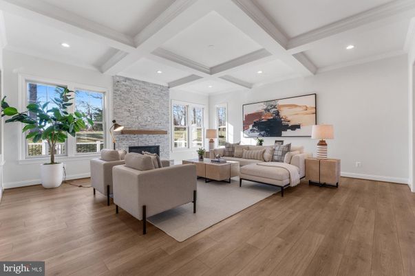 Fireplace, Interior, Living room, Recessed Lighting, Stone Walls, Wood Texture Flooring