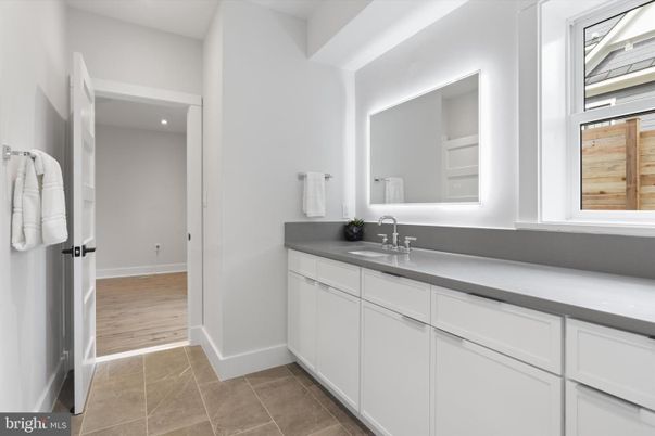 Bathroom, Dual Sink Vanities, Interior, Recessed Lighting, Wood Texture Flooring