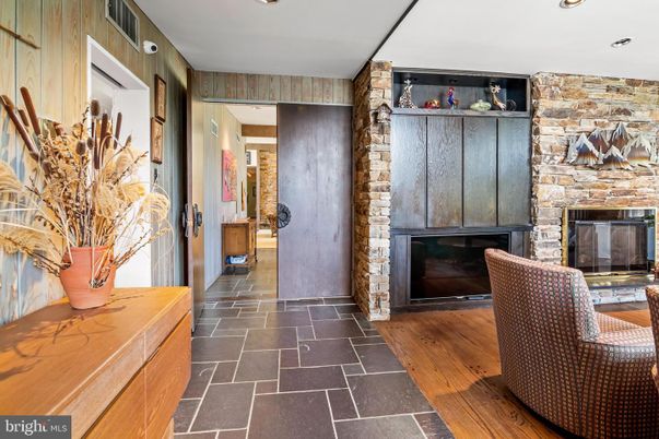 Fireplace, Interior, Recessed Lighting, Stone Walls, Wood Texture Flooring