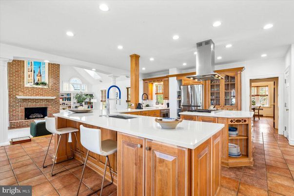 Fireplace, Interior, Kitchen, Recessed Lighting, Stainless Steel Appliances, Stone Walls