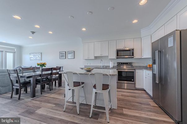 Dining room, Interior, Kitchen, Recessed Lighting, Stainless Steel Appliances, Wood Texture Flooring