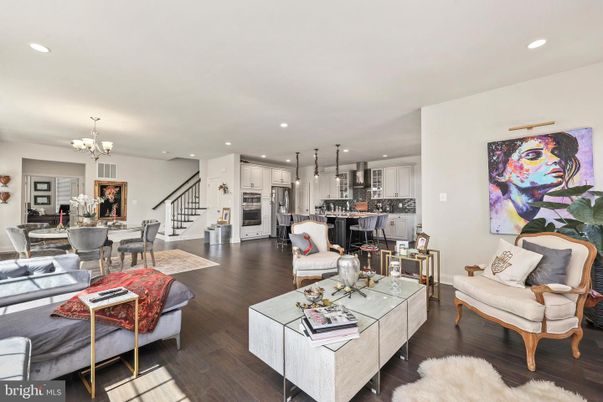 Chandelier, Dining room, Interior, Kitchen, Living room, Pendant Lights, Recessed Lighting, Stainless Steel Appliances, Wood Texture Flooring