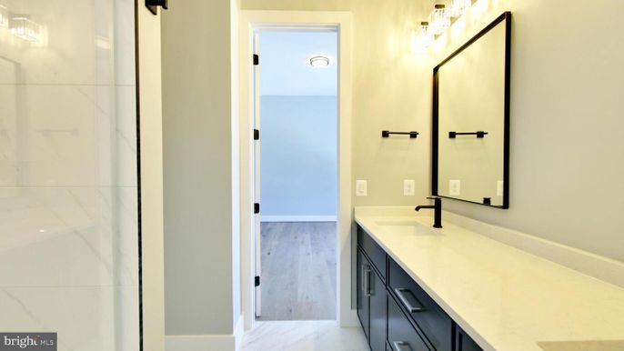 Bathroom, Dual Sink Vanities, Interior, Marble, Marble Walls, Wood Texture Flooring