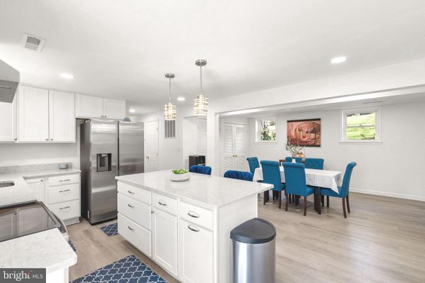 Dining room, Interior, Kitchen, Pendant Lights, Recessed Lighting, Stainless Steel Appliances, Wood Texture Flooring