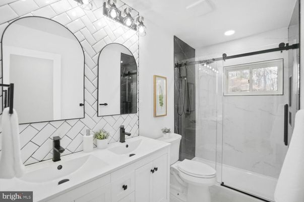 Bathroom, Dual Sink Vanities, Glass Shower, Interior, Marble Walls, Recessed Lighting