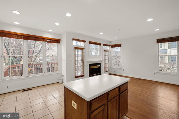 Empty room, Fireplace, Interior, Kitchen, Recessed Lighting, Wood Texture Flooring