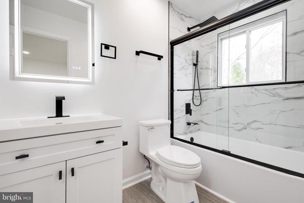 Bathroom, Glass Shower, Interior, Marble Walls, Recessed Lighting, Wood Texture Flooring