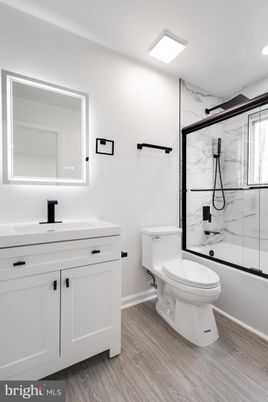 Bathroom, Glass Shower, Interior, Marble Walls, Recessed Lighting, Wood Texture Flooring