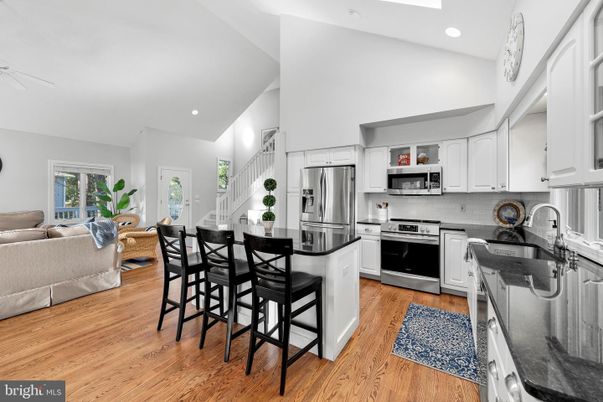 Dining room, Interior, Kitchen, Living room, Recessed Lighting, Stainless Steel Appliances, Wood Texture Flooring