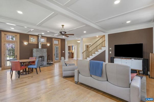 Dining room, Fireplace, Interior, Living room, Recessed Lighting, Wood Texture Flooring