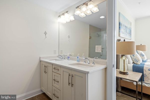 Bathroom, Dual Sink Vanities, Interior, Recessed Lighting, Wood Texture Flooring