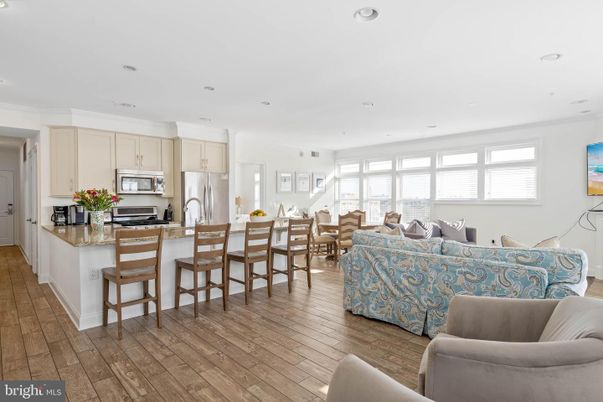 Dining room, Interior, Kitchen, Living room, Recessed Lighting, Stainless Steel Appliances, Wood Texture Flooring