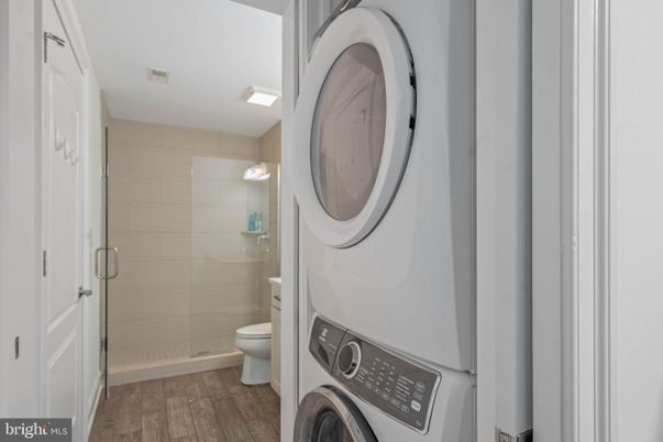 Bathroom, Glass Shower, Interior, Washer, Wood Texture Flooring