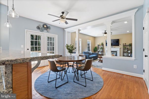 Dining room, Fireplace, Interior, Living room, Pendant Lights, Recessed Lighting, Wood Texture Flooring