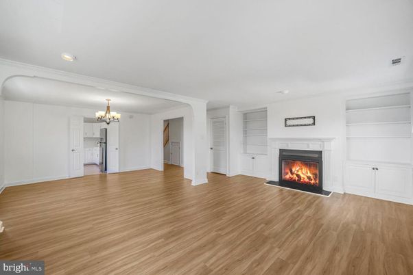 Chandelier, Empty room, Fireplace, Interior, Recessed Lighting, Wood Texture Flooring
