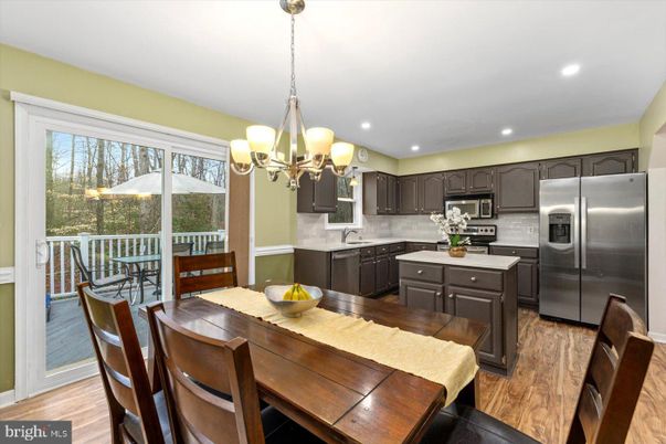 Chandelier, Dining room, Interior, Kitchen, Recessed Lighting, Stainless Steel Appliances, Wood Texture Flooring