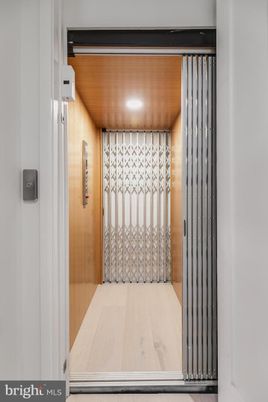 Elevator, Interior, Recessed Lighting, Wooden Ceilings, Wood Texture Flooring, Wooden Walls
