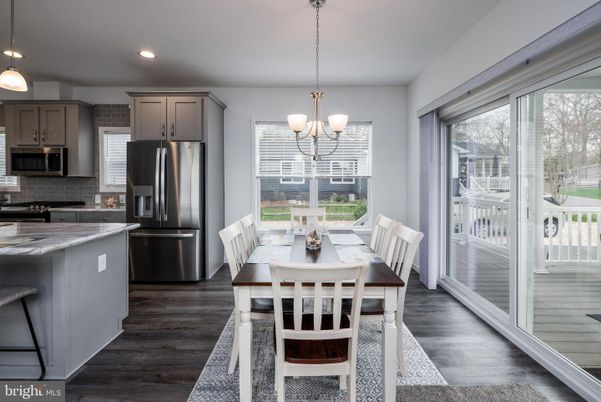 Chandelier, Dining room, Interior, Kitchen, Pendant Lights, Recessed Lighting, Stainless Steel Appliances, Wood Texture Flooring