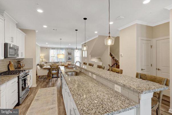 Dining room, Interior, Kitchen, Living room, Pendant Lights, Recessed Lighting, Stainless Steel Appliances, Wood Texture Flooring