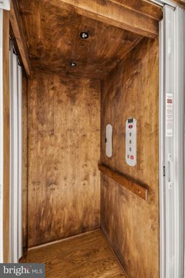 Elevator, Interior, Recessed Lighting, Wooden Ceilings, Wood Texture Flooring, Wooden Walls