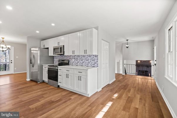 Fireplace, Interior, Kitchen, Pendant Lights, Recessed Lighting, Stainless Steel Appliances, Wood Texture Flooring