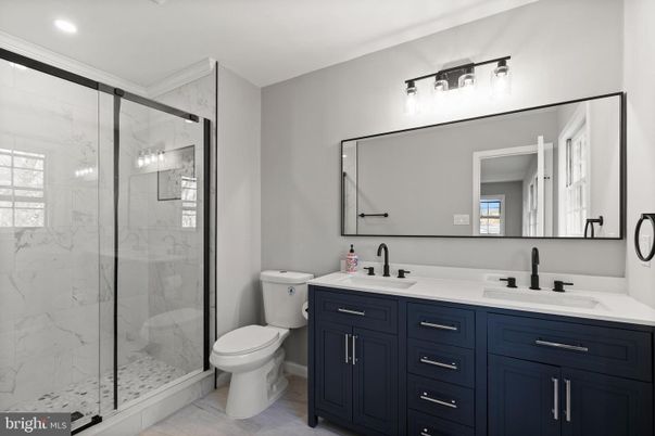 Bathroom, Dual Sink Vanities, Glass Shower, Interior, Marble Walls, Recessed Lighting