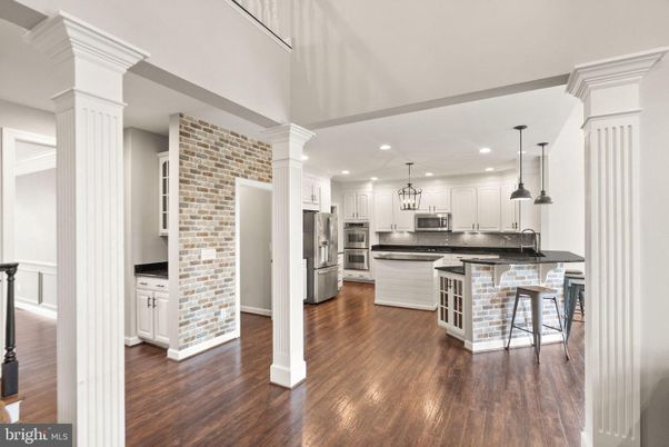Interior, Kitchen, Pendant Lights, Recessed Lighting, Stainless Steel Appliances, Stone Walls, Wood Texture Flooring