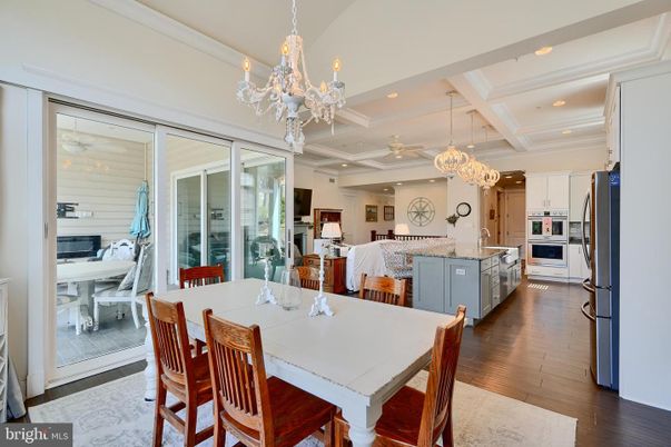Chandelier, Dining room, Interior, Kitchen, Pendant Lights, Recessed Lighting, Stainless Steel Appliances, Wood Texture Flooring