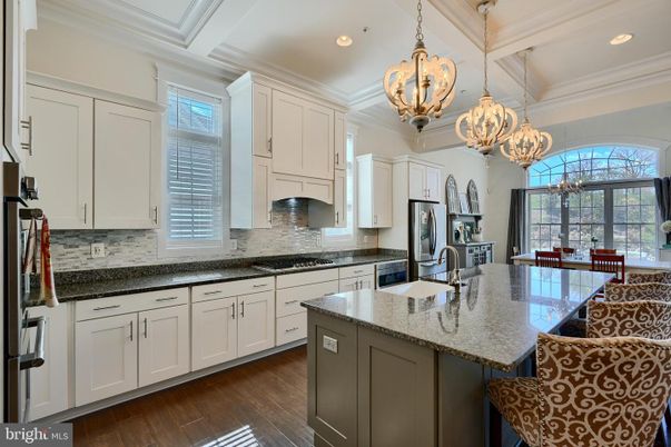 Chandelier, Dining room, Interior, Kitchen, Pendant Lights, Recessed Lighting, Stainless Steel Appliances, Wood Texture Flooring