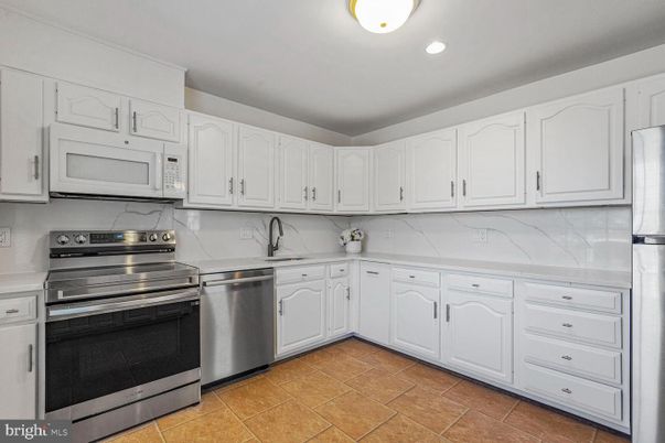 Interior, Kitchen, Marble Walls, Recessed Lighting, Stainless Steel Appliances