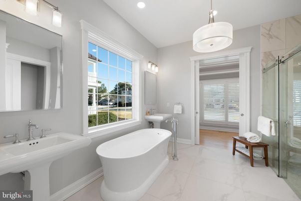 Bathroom, Dual Sink Vanities, Free Standing Baths, Glass Shower, Interior, Marble, Marble Walls, Pendant Lights, Recessed Lighting