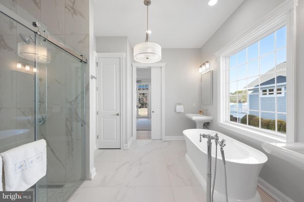 Bathroom, Free Standing Baths, Glass Shower, Interior, Marble, Marble Walls, Pendant Lights, Recessed Lighting