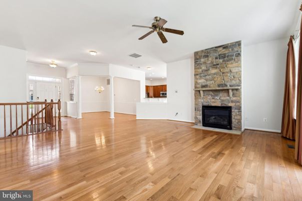 Empty room, Fireplace, Interior, Recessed Lighting, Stone Walls, Wood Texture Flooring