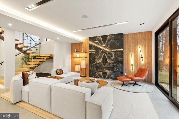 Fireplace, Interior, Living room, Marble Walls, Recessed Lighting, Wood Texture Flooring