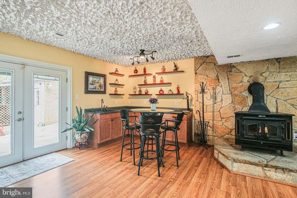 Fireplace, Interior, Recessed Lighting, Stone Walls, Wood Texture Flooring